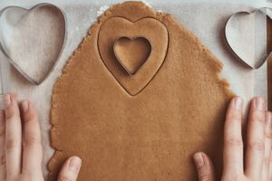 Making gingerbread cookies in the shape of a heart for Valentines Day